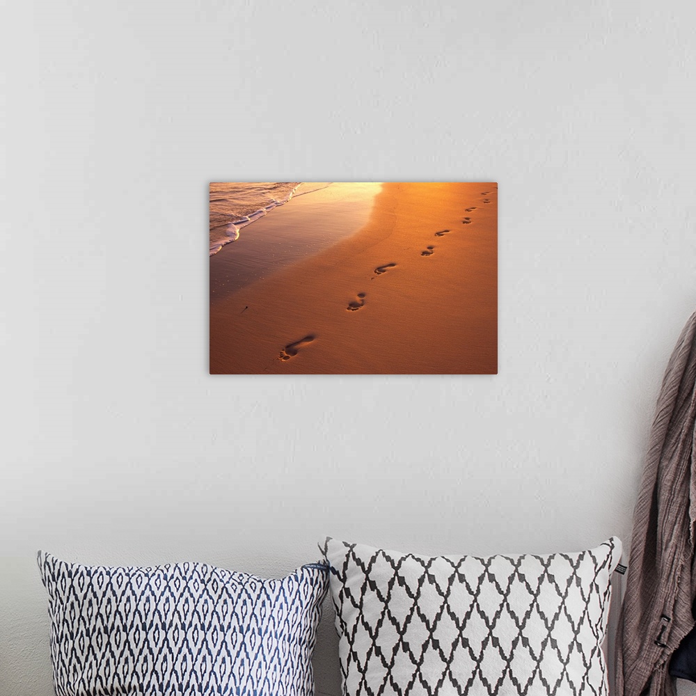 A bohemian room featuring Footprints In Sand At Sunset