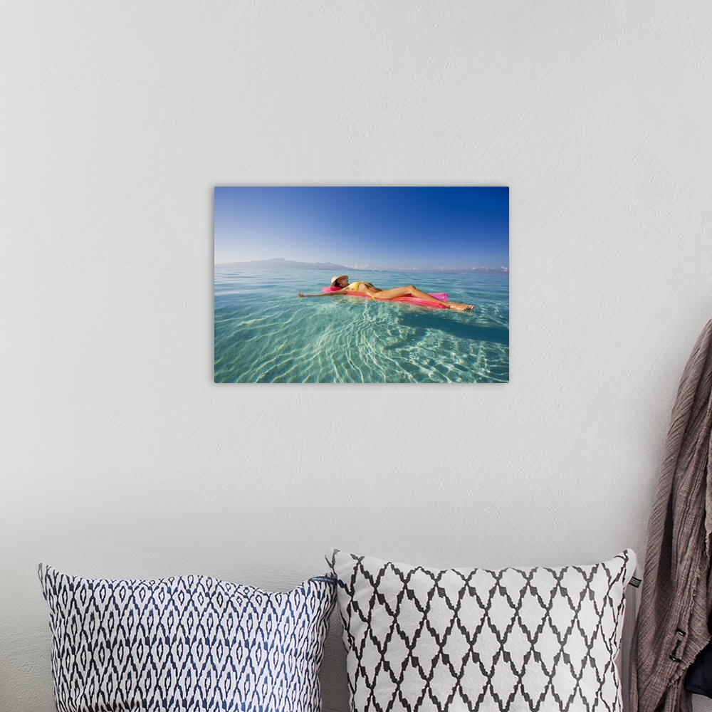 A bohemian room featuring French Polynesia, Tahiti, Moorea, Woman Floating In Water