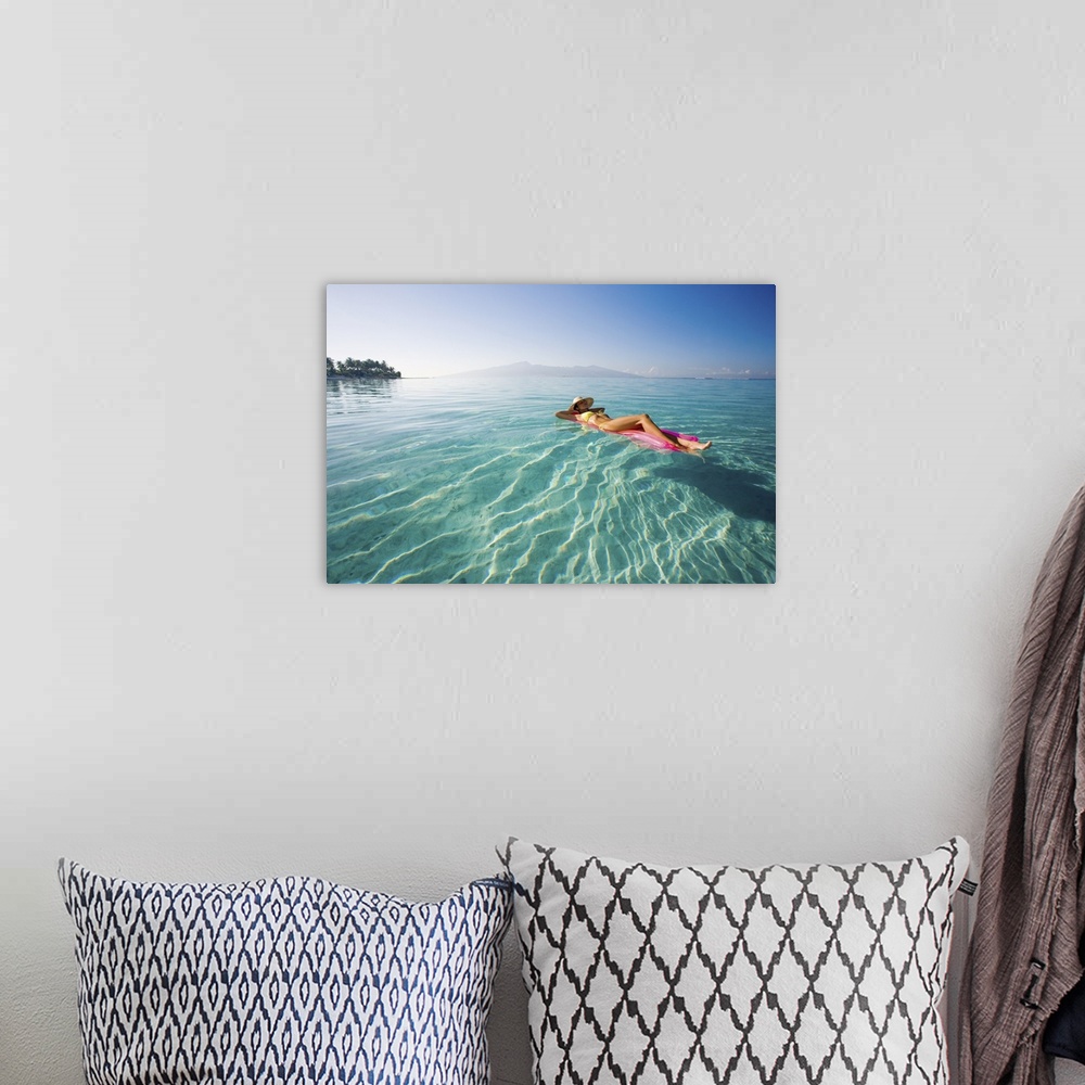 A bohemian room featuring French Polynesia, Tahiti, Moorea, Woman Floating In Water