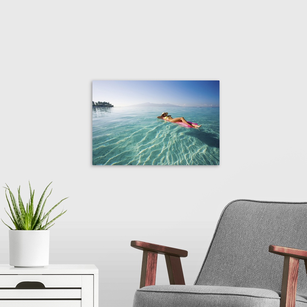 A modern room featuring French Polynesia, Tahiti, Moorea, Woman Floating In Water