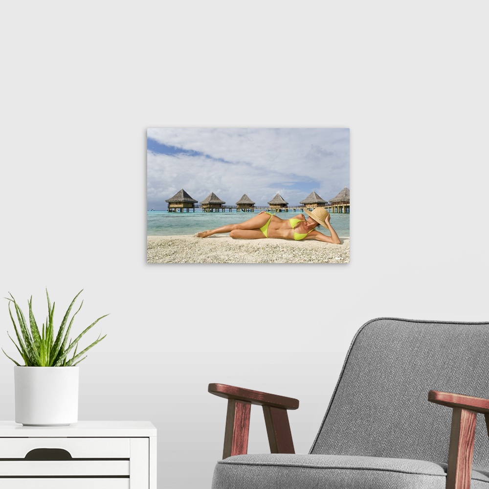 A modern room featuring French Polynesia, Tuamotu Islands, Rangiroa Atoll, Woman Lounging On Beach