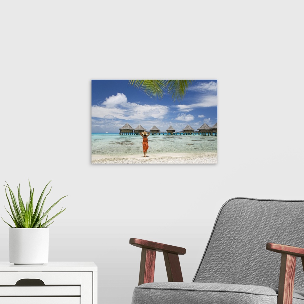 A modern room featuring French Polynesia, Tuamotu Islands, Rangiroa Atoll, Woman On Beach Near Luxury Resort