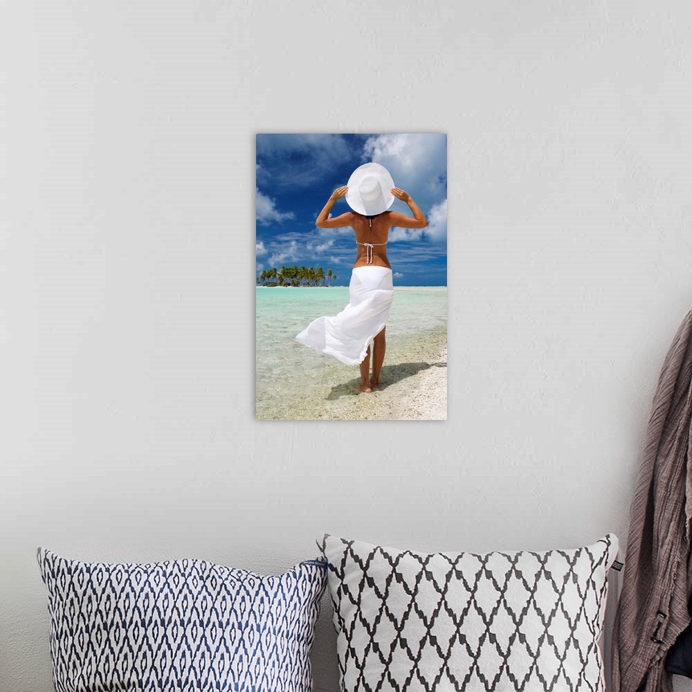 A bohemian room featuring French Polynesia, Tuamotu Islands, Rangiroa Atoll, Woman Standing At Ocean's Edge