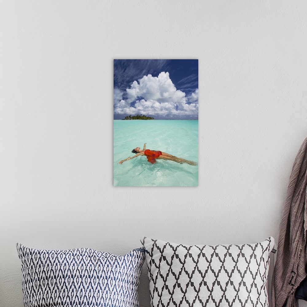 A bohemian room featuring French Polynesia, Woman Floating In Ocean Water