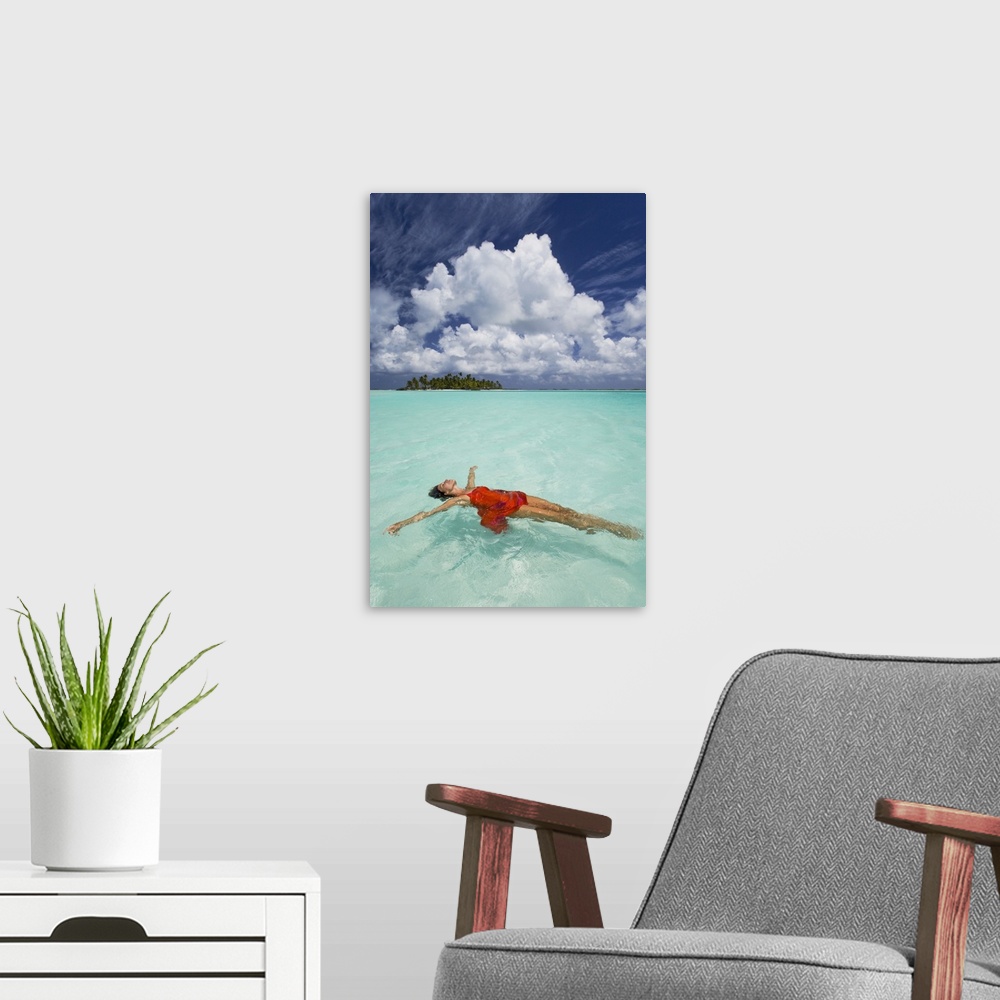 A modern room featuring French Polynesia, Woman Floating In Ocean Water