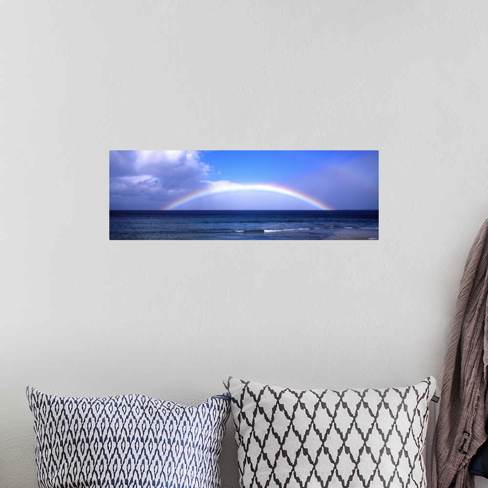 A bohemian room featuring Full Rainbow Over Ocean, Large Clouds Against Blue Sky