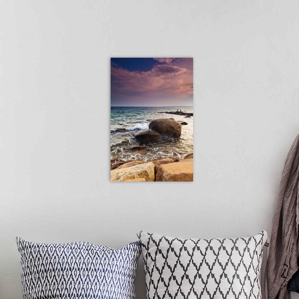 A bohemian room featuring Glowing pink clouds at sunset and rocks along the coast, Falmouth, Massachusetts