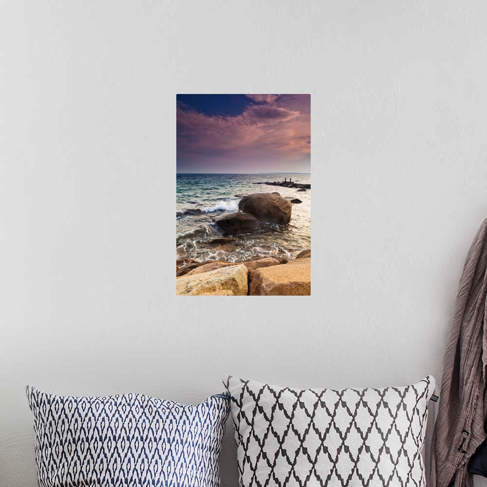 A bohemian room featuring Glowing pink clouds at sunset and rocks along the coast, Falmouth, Massachusetts