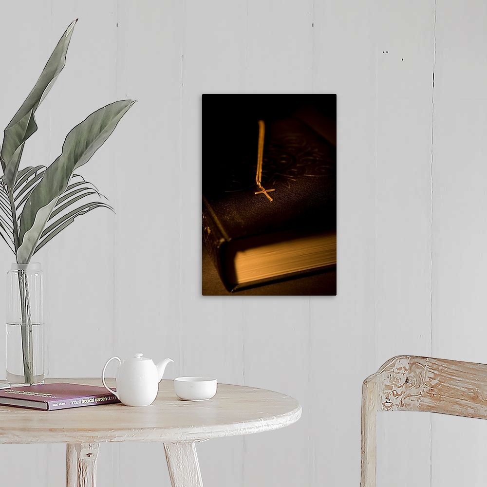 A farmhouse room featuring Gold Cross Pendant Resting On A Book