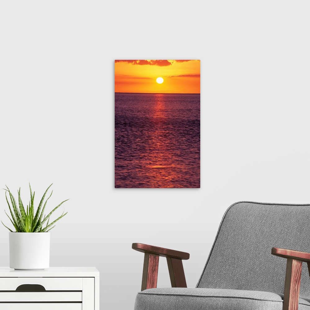 A modern room featuring Golden Sun Ball, Sunset With Orange Sky Over Ocean Purple Surface