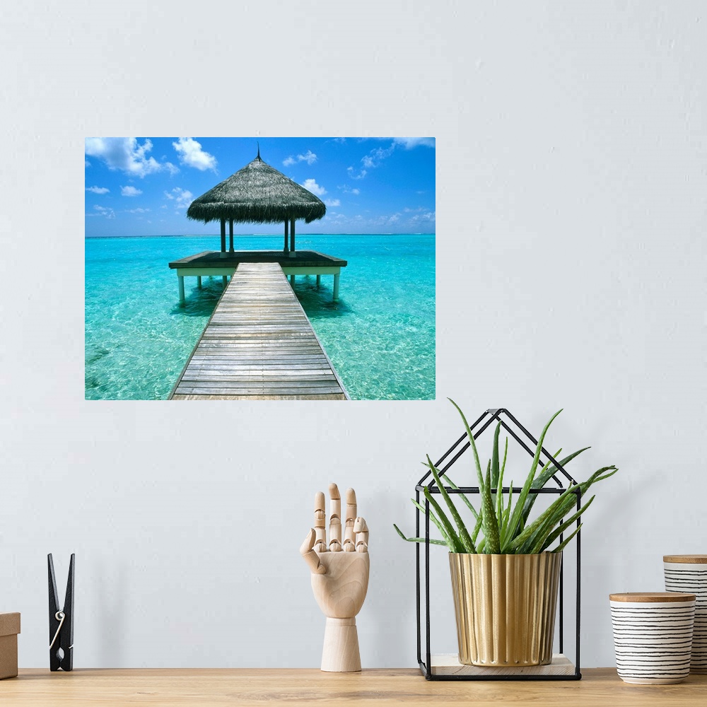A bohemian room featuring Grass Hut And Pier; The Maldives