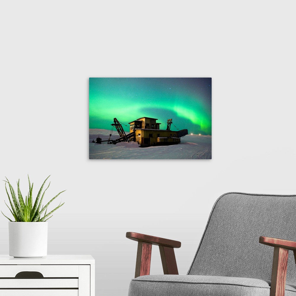 A modern room featuring Green Northern Lights Dance Over A Historical Gold Dredge Near Nome, Alaska