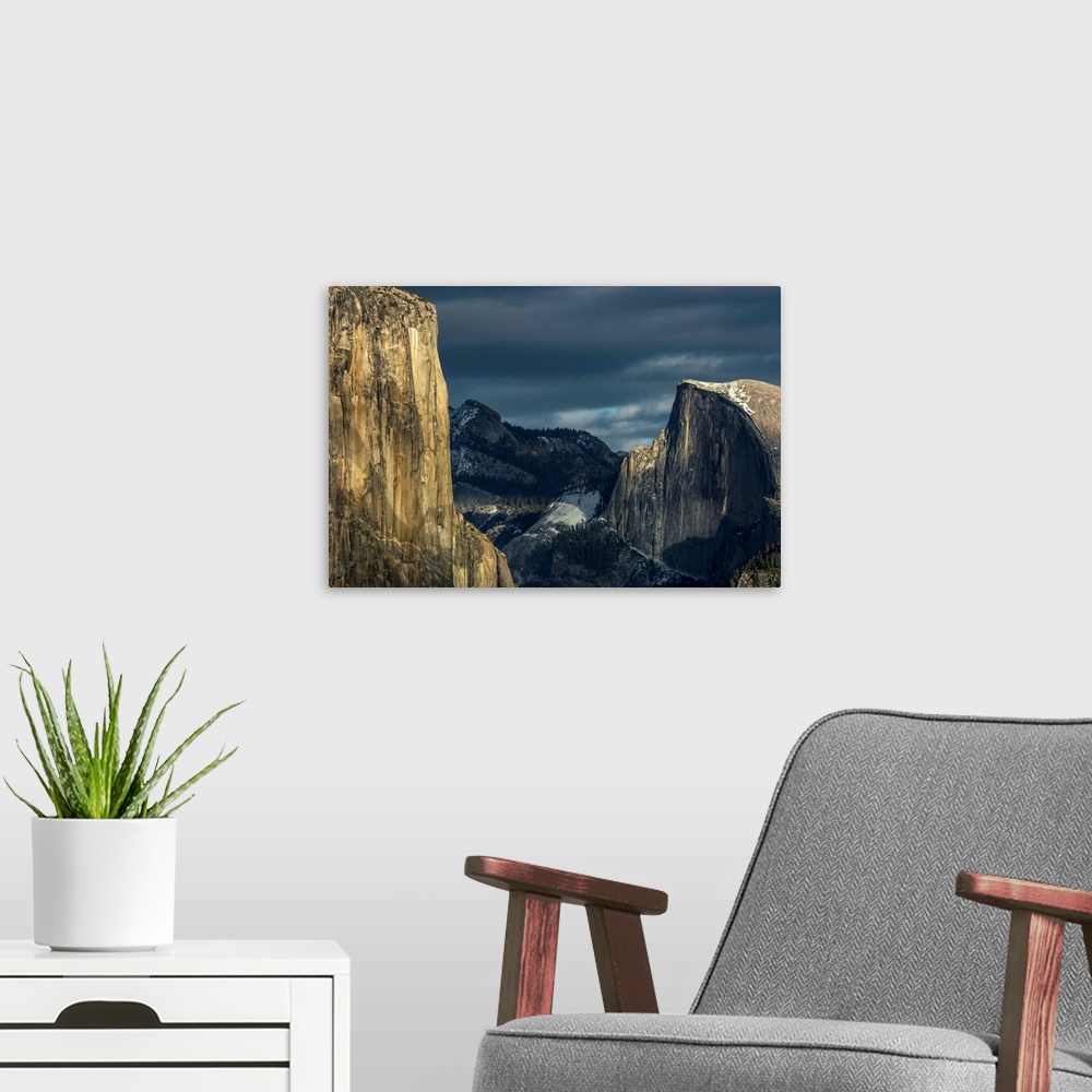 A modern room featuring El Capitan and Half Dome in late afternoon winter light, as seen from Turtleback Dome in Yosemite...