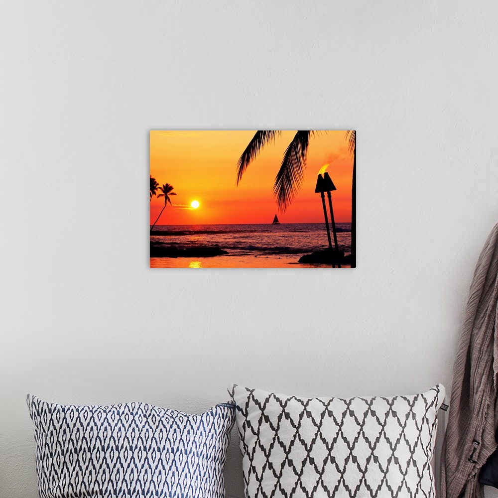 A bohemian room featuring This is a landscape photograph of the sun setting on a tropical beach where all the landscape fea...