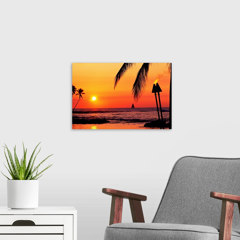A modern room featuring This is a landscape photograph of the sun setting on a tropical beach where all the landscape fea...