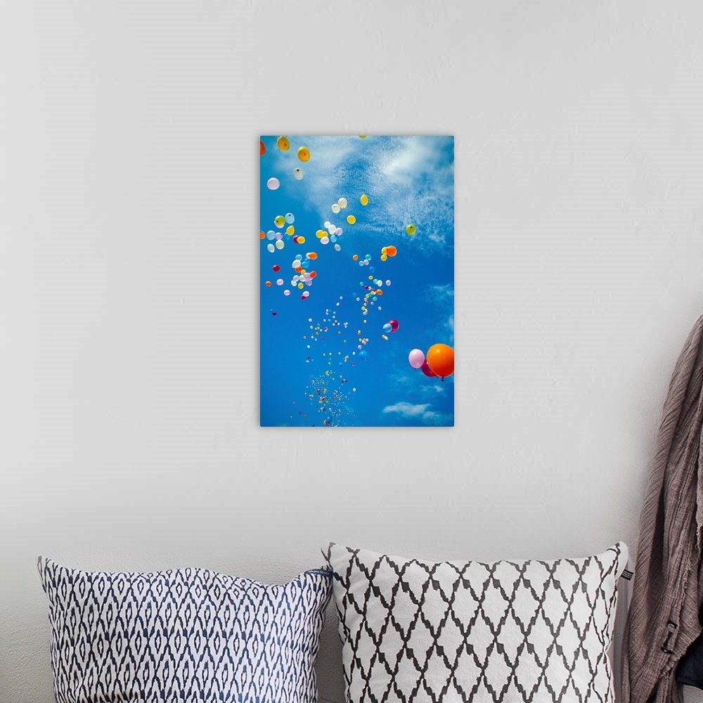 A bohemian room featuring Hawaii, Colorful Balloons Float In The Air Against A Blue Sky With Clouds