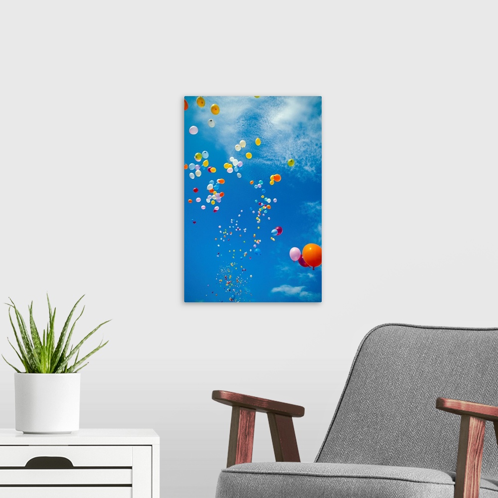 A modern room featuring Hawaii, Colorful Balloons Float In The Air Against A Blue Sky With Clouds