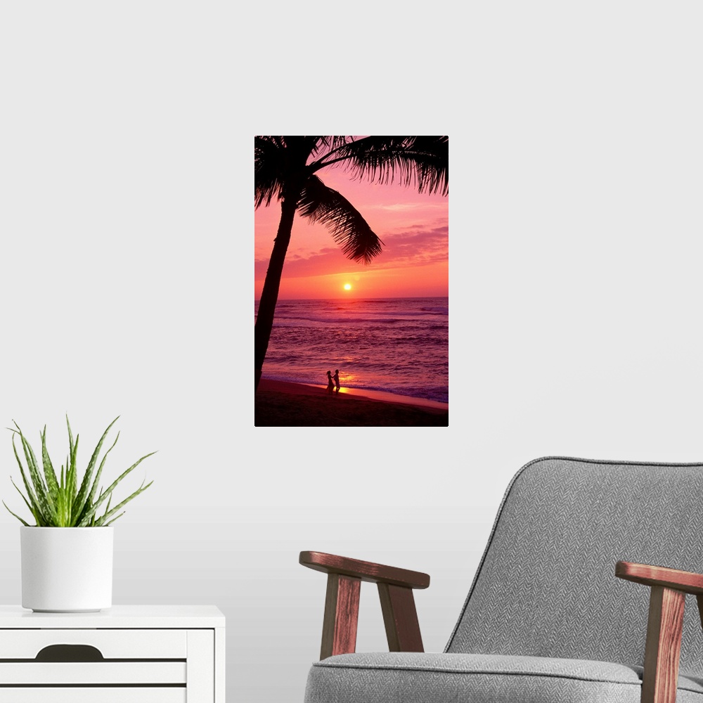 A modern room featuring Hawaii, Couple Silhouetted On The Beach At Sunset With Tall Palm Foreground