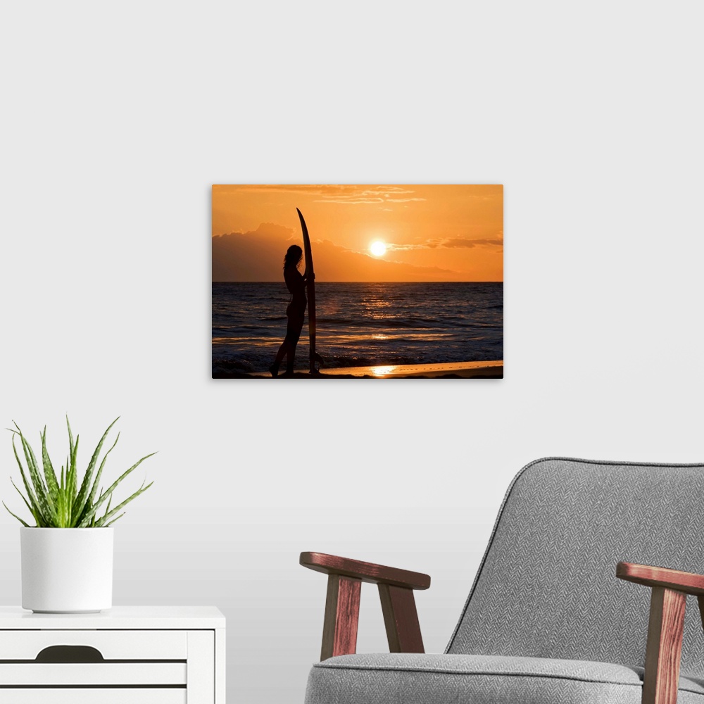 A modern room featuring Hawaii, Female Surfer On Beach Silhouetted Against Orange Sunset Over Ocean