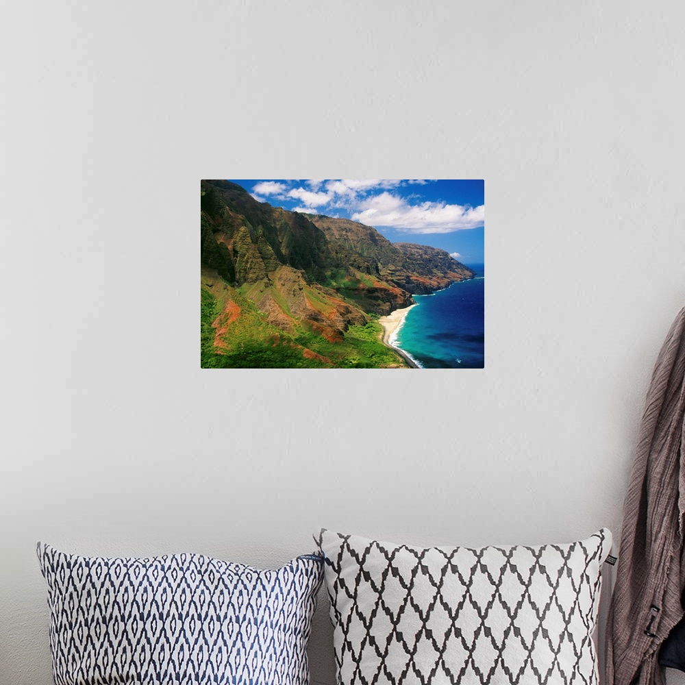 A bohemian room featuring Immense cliffs that line the Hawaiian coast are photographed on a bright sunny day.