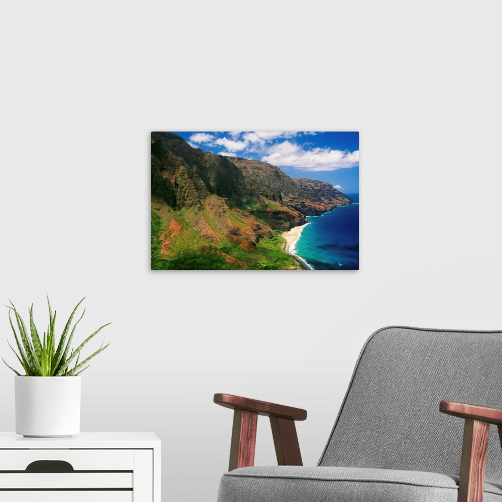 A modern room featuring Immense cliffs that line the Hawaiian coast are photographed on a bright sunny day.