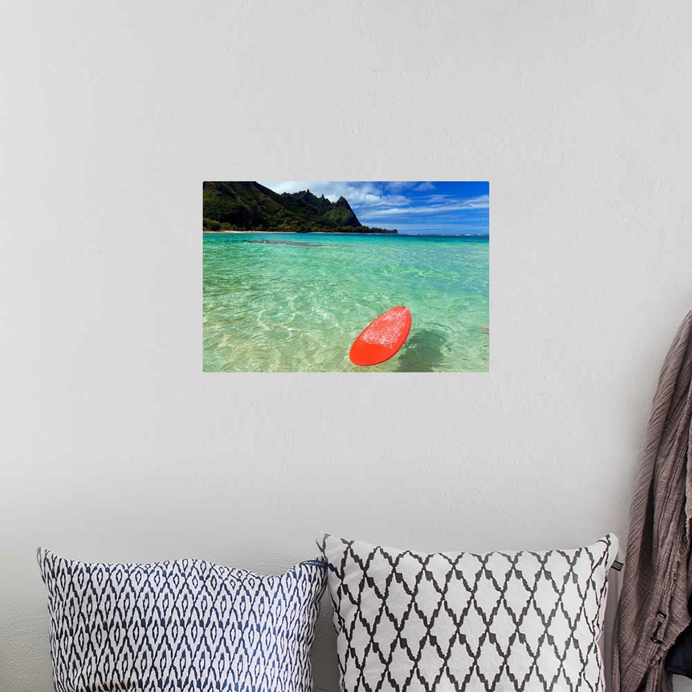 A bohemian room featuring Photograph of bobbing surfboard in ocean with crystal clear waters and a small beach with tree co...