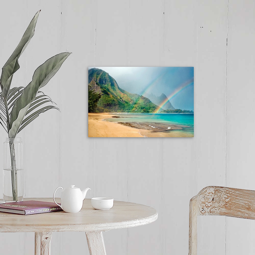 A farmhouse room featuring A landscape photograph with double rainbows on a tropical beach with mountains in the background.