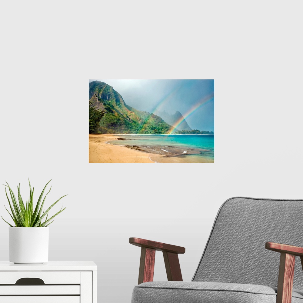 A modern room featuring A landscape photograph with double rainbows on a tropical beach with mountains in the background.