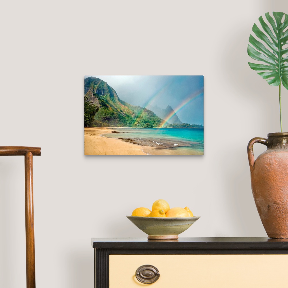 A traditional room featuring A landscape photograph with double rainbows on a tropical beach with mountains in the background.