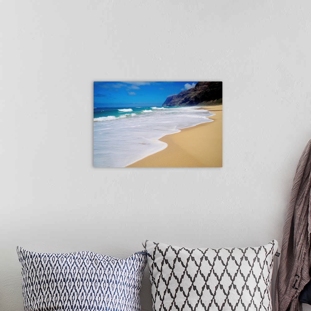 A bohemian room featuring Horizontal, oversized photograph of the shoreline at Polihale Beach in Kauai, Hawaii.  A cliff an...
