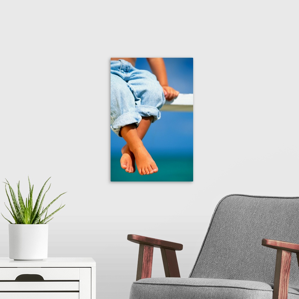 A modern room featuring Hawaii, Legs And Feet Of Young Boy Sitting On A Bench By The Ocean
