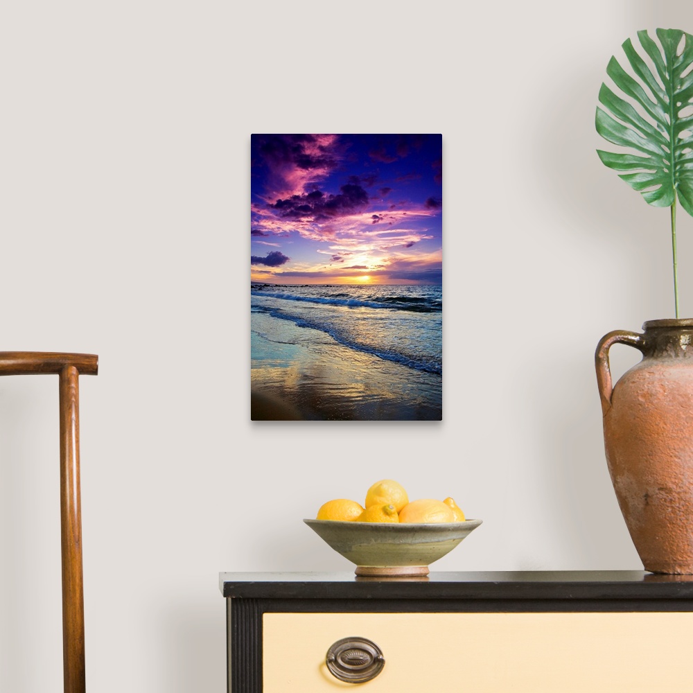 A traditional room featuring Large photograph displays the waves of the Pacific Ocean slowly coming into shore and crashing ag...