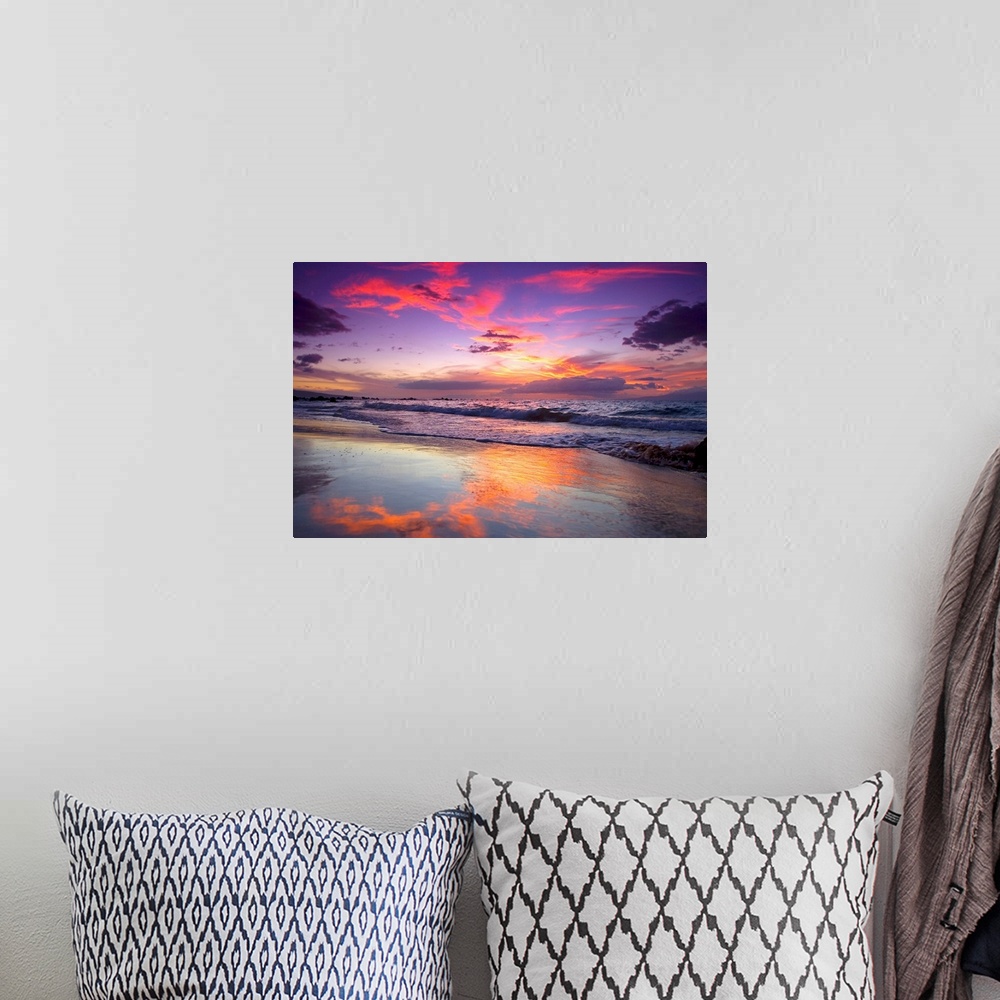 A bohemian room featuring Large photograph of waves crashing on Maui shore  as the sun sets behind the clouds.