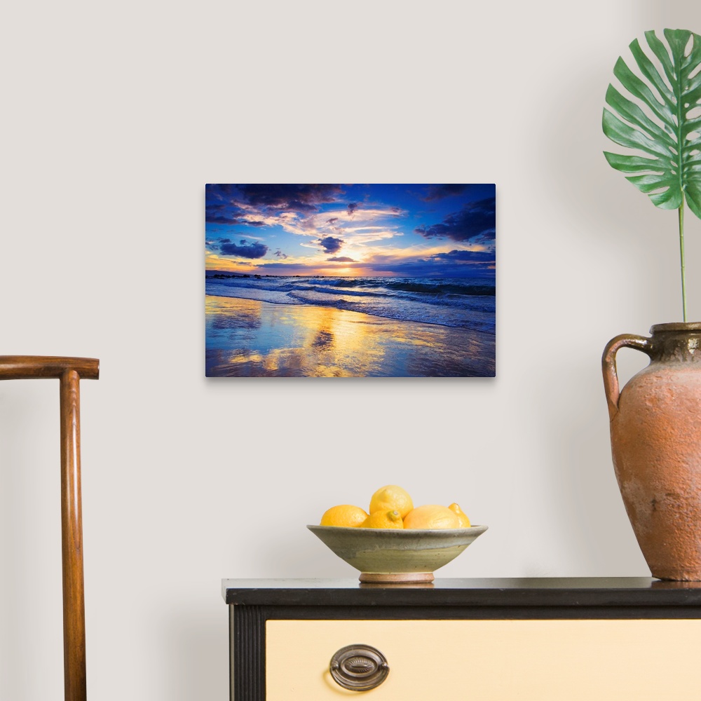 A traditional room featuring Horizontal photograph on a large wall hanging of a vivid sunset glowing through clouds, over the ...