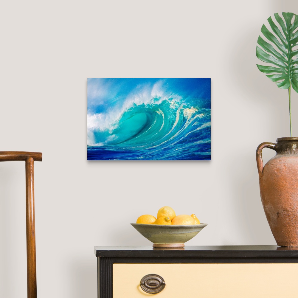 A traditional room featuring Big photograph showcases a giant wave after it has curled and now prepares to break against the s...