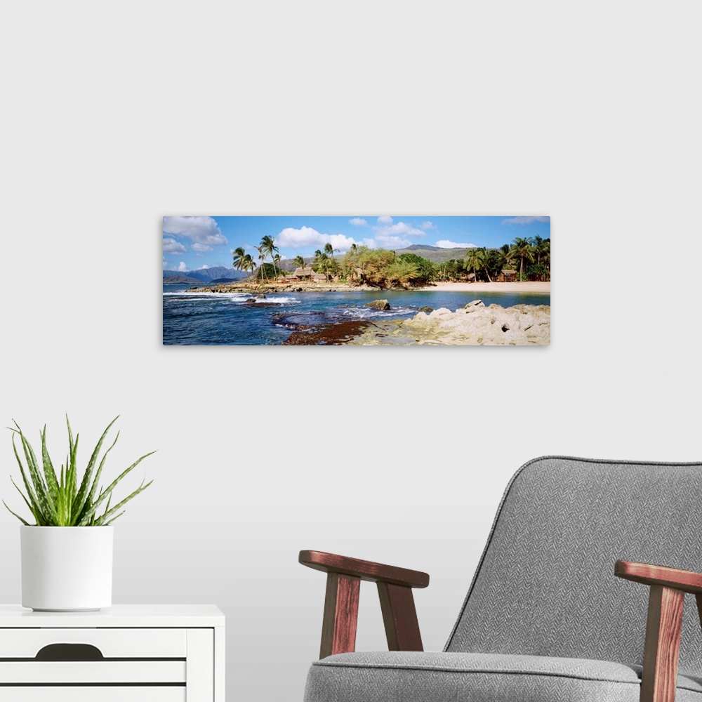 A modern room featuring Hawaii, Oahu, Paradise Cove, Thatched Huts Along Shoreline