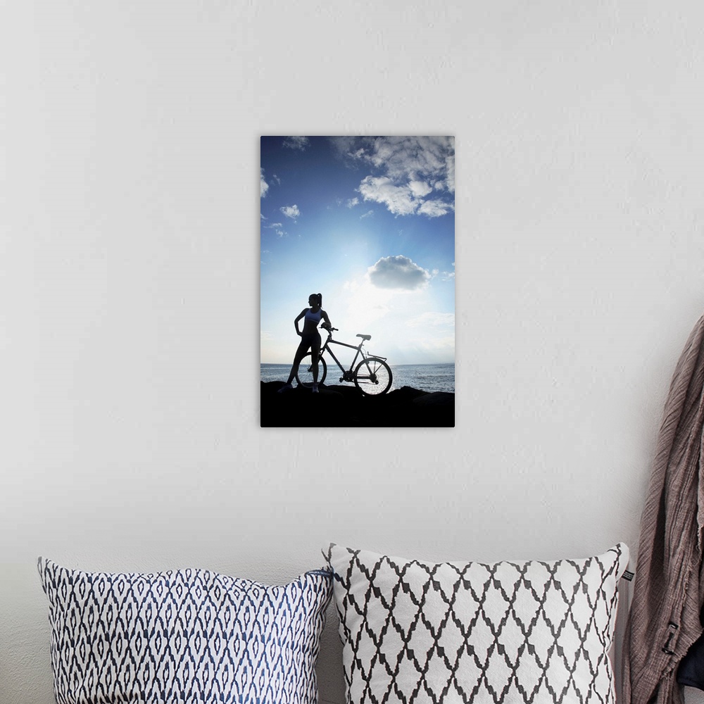 A bohemian room featuring Hawaii, Oahu, Silhouette Of A Woman With A Bike On A Rocky Coastline