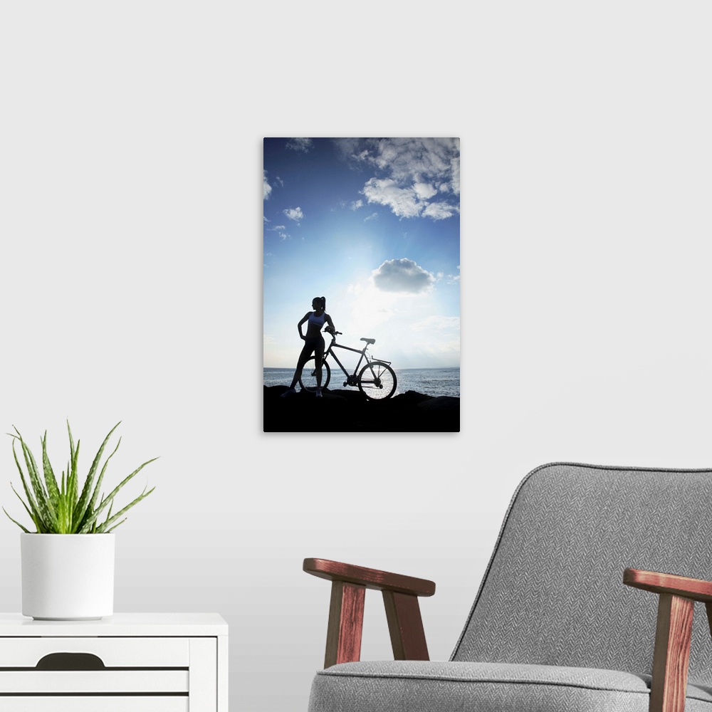 A modern room featuring Hawaii, Oahu, Silhouette Of A Woman With A Bike On A Rocky Coastline