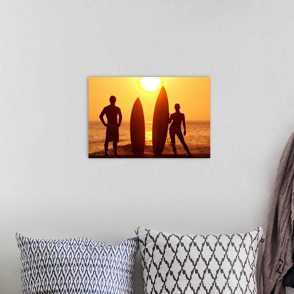 A bohemian room featuring Hawaii, Oahu, Silhouette Of Man And Woman On Beach With Surfboards At Sunset