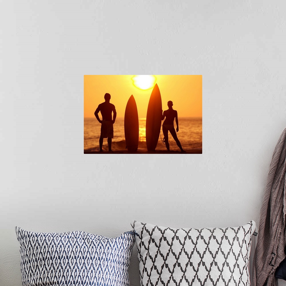 A bohemian room featuring Hawaii, Oahu, Silhouette Of Man And Woman On Beach With Surfboards At Sunset