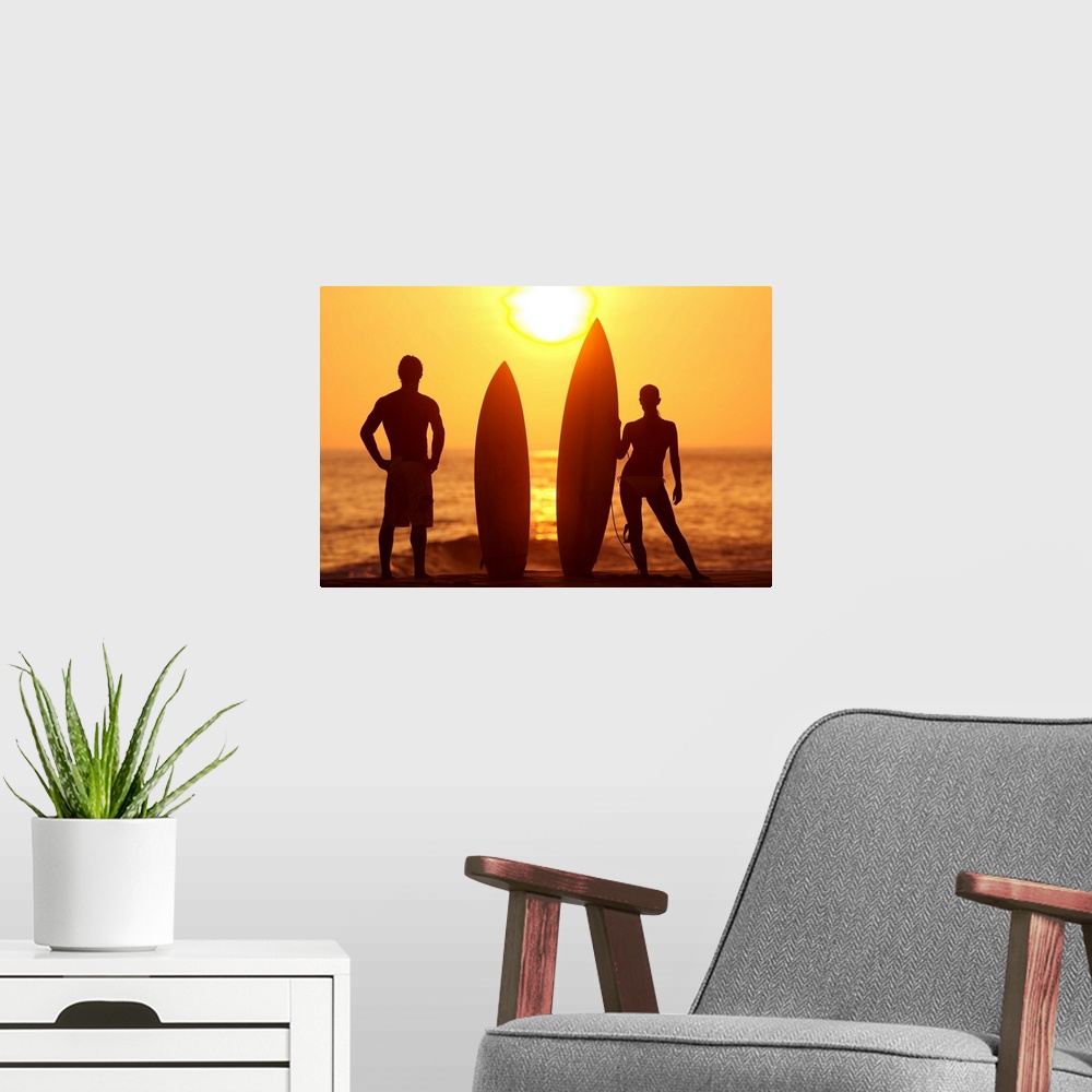 A modern room featuring Hawaii, Oahu, Silhouette Of Man And Woman On Beach With Surfboards At Sunset