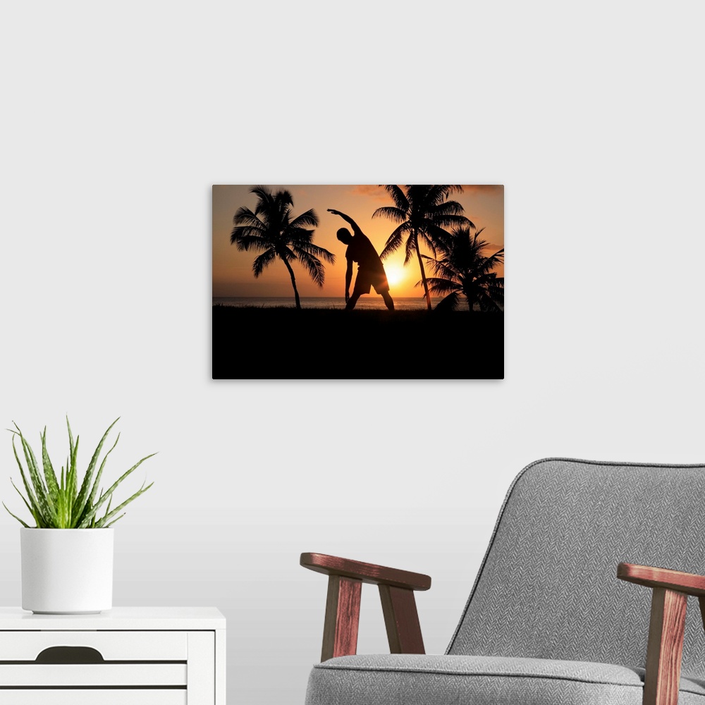 A modern room featuring Hawaii, Oahu, Silhouette Of Man Stretching Near The Beach As The Golden Sunsets