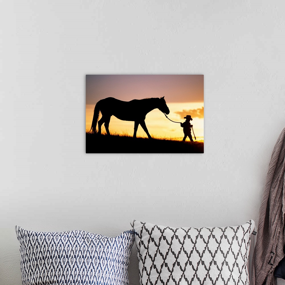 A bohemian room featuring This is a landscape photograph of a small child walking down a hill at twilight making it perfect...