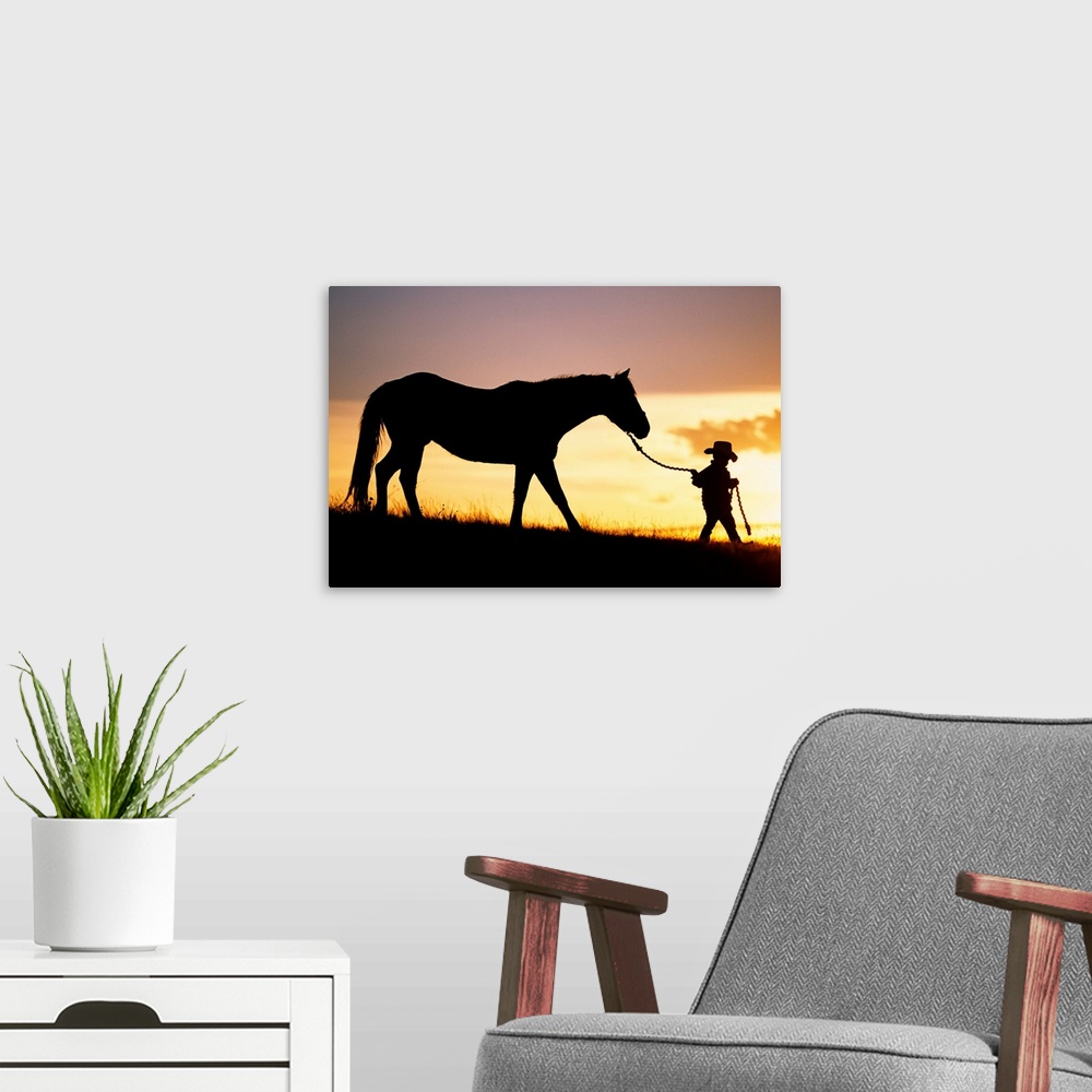 A modern room featuring This is a landscape photograph of a small child walking down a hill at twilight making it perfect...