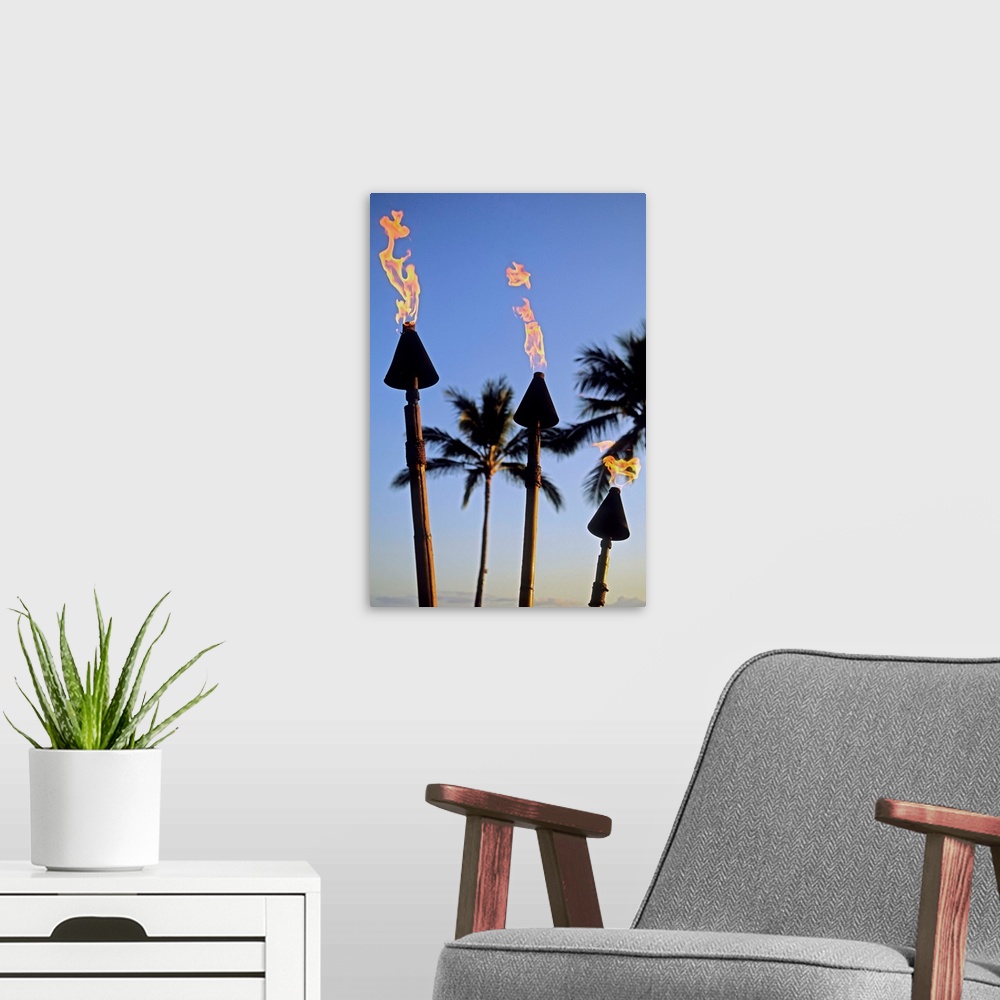 A modern room featuring Hawaii, Tiki Torches Lit At Dusk, Palm Trees And Blue Sky