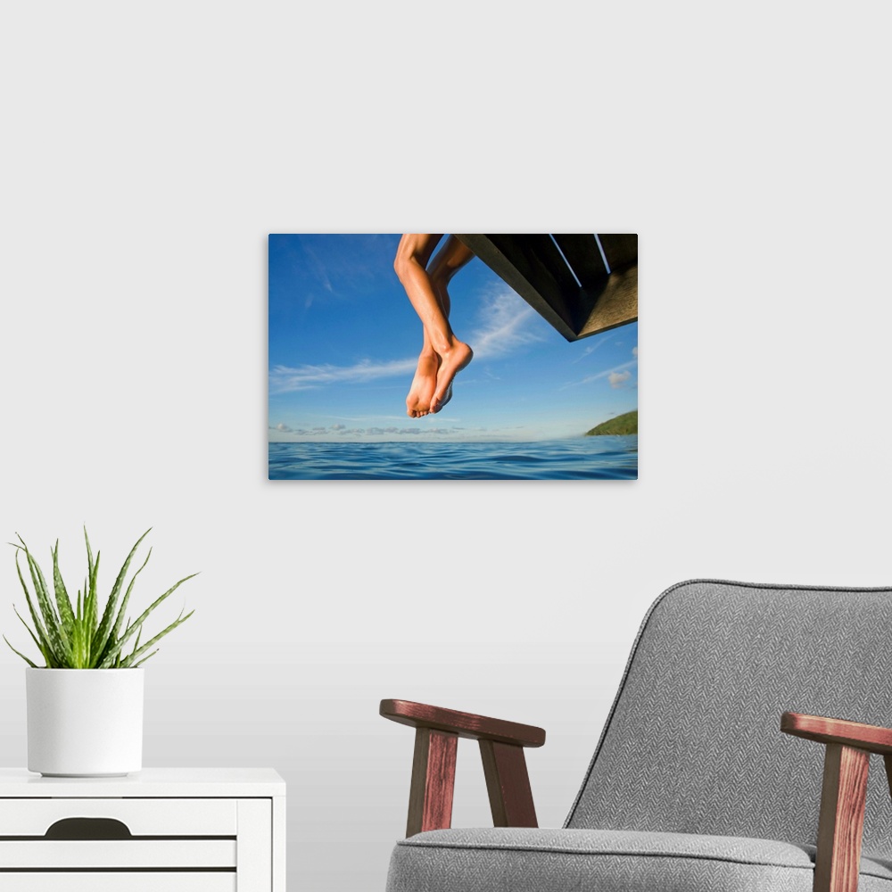 A modern room featuring Hawaii, Womans Legs Hanging From Dock