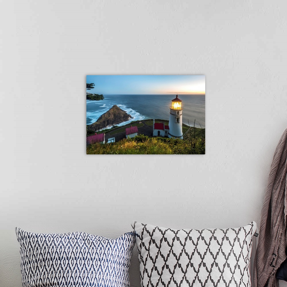 A bohemian room featuring Heceta Head lighthouse at dusk, Oregon, USA
