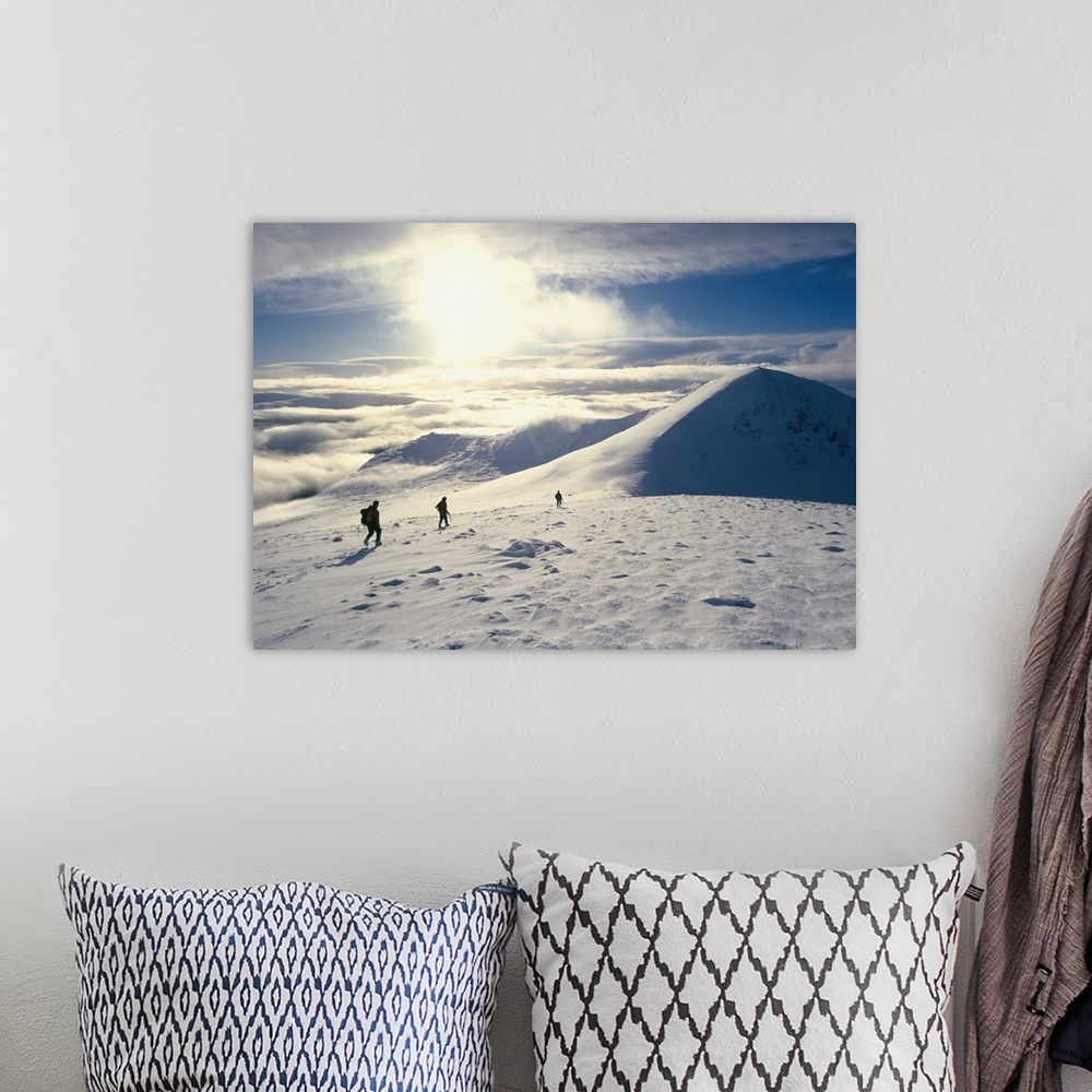 A bohemian room featuring Hikers On A Mountaintop In The Snow; Scotland