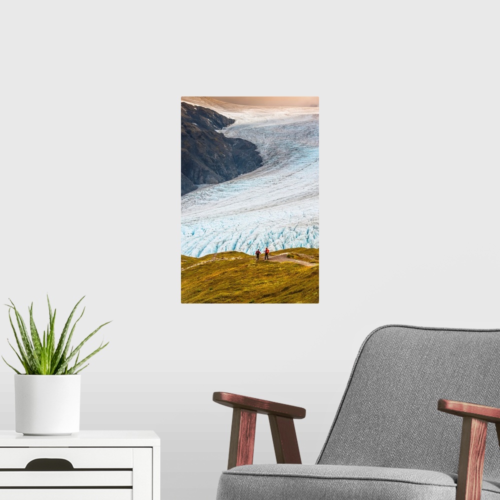 A modern room featuring A man and woman hiking down the Harding Icefield Trail with Exit Glacier in the background, Kenai...