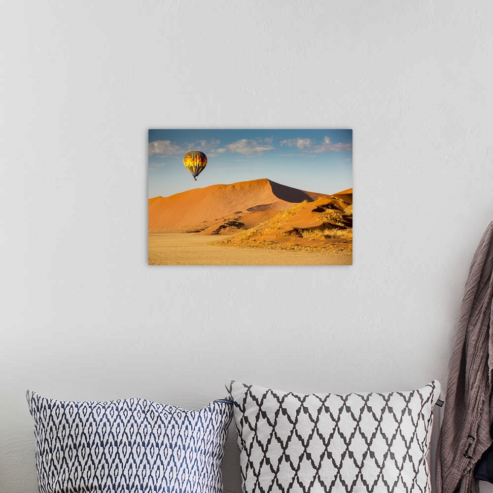 A bohemian room featuring Hot air balloon ride over the red sand dunes of Sossusvlei in Namibia; Sossusvlei, Hardap Region,...